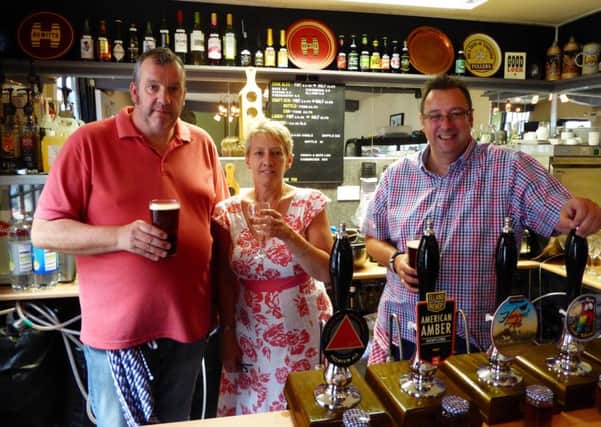 Cheers to this new business - Pictured is: Tony Howkins, Lisa Howkins and David Stamp.