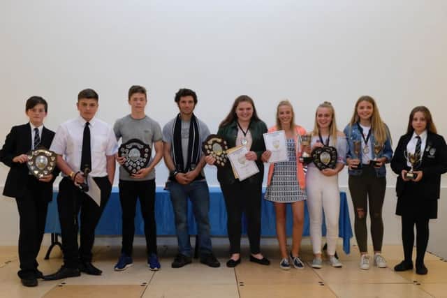 Some of the award-winning sports students with bike ace Guy Martin EMN-170718-172150001
