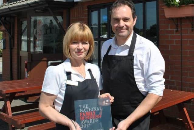 Tracey Donoghue and Nigel Tindall of the Elite Fish and Chjip Company with the National Family Business Award. EMN-170717-193329001