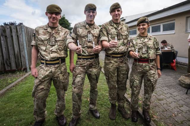 German based UK troops sign up to Donor Register in the hope of finding a match to save a colleague Private (Pte) Myles Brown from the 1st Battalion Princess of Wales's Royal Regiment. From left - Pte Lee Schooling, Pte Jason Scottow, Captain Liam Praill and Pte Gaitley with their samples for testing. Photo: Dominic King EMN-170718-091902001