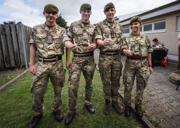 German based UK troops sign up to Donor Register in the hope of finding a match to save a colleague Private (Pte) Myles Brown from the 1st Battalion Princess of Wales's Royal Regiment. From left - Pte Lee Schooling, Pte Jason Scottow, Captain Liam Praill and Pte Gaitley with their samples for testing. Photo: Dominic King EMN-170718-091902001