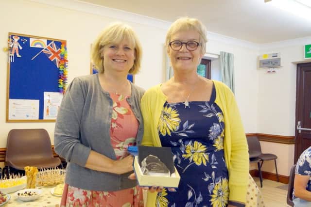 Rosemary Walker receiving her award from Julia Weeks EMN-170718-105034001