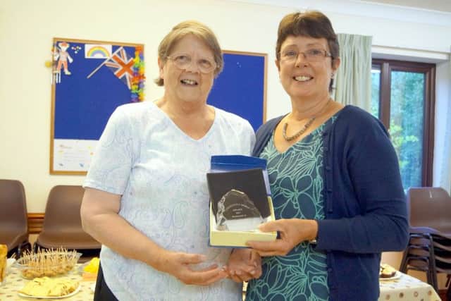 Veronica Chamberlin receiving her award from Mary Jordan EMN-170718-105008001