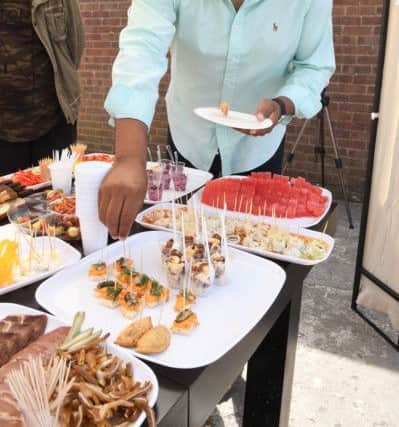 Korzinka open day. Allan Ross of Boston trying food.