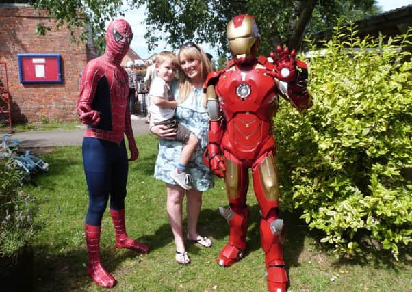 Tommy Richardson with Mum Joanne neet Spiderman and Ironman.  (Lin) EMN-170718-093146001