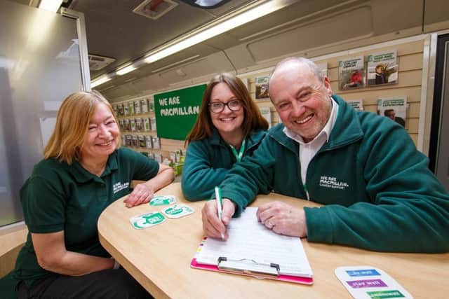 Margaret Watts (Information Specialist), Moray Hayman (Information Specialist) Jeremy Burman (Facilities Officer) inside Betty, the Macmillan Mobile Information Bus