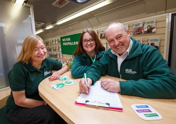 Margaret Watts (Information Specialist), Moray Hayman (Information Specialist) Jeremy Burman (Facilities Officer) inside Betty, the Macmillan Mobile Information Bus