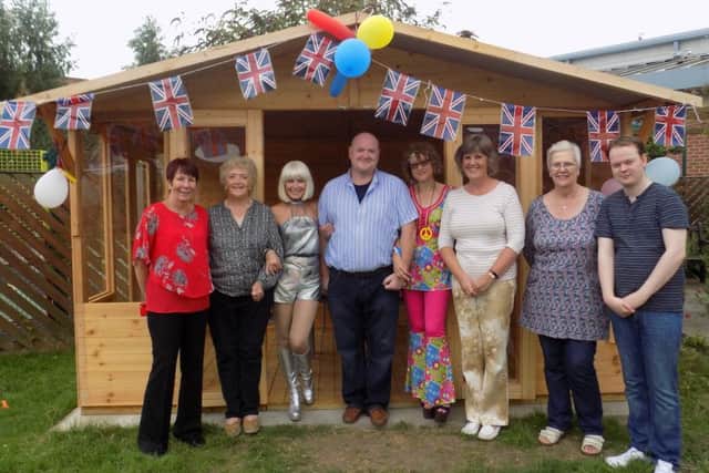 At the Ashfield Lodge summerhouse. From left - Avril , Karen, Sharon (singer) Jeff (Home Manager), Cheryl (day-care coordinator), Amanda, Pat and Thomas. EMN-170720-141521001