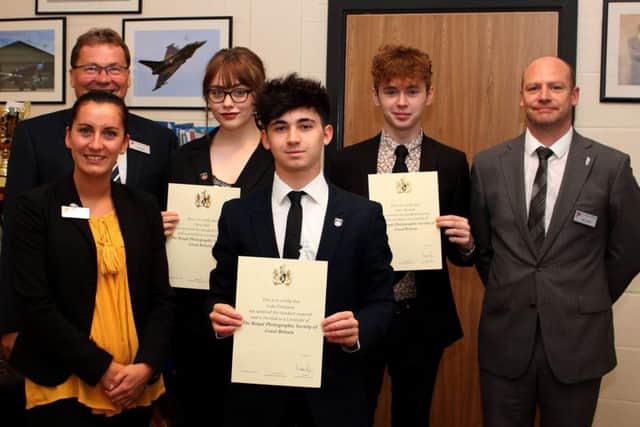 The presentation of the LRPS awards by Wayne Birks (Principal) (back left) to Daisy Hall, Luke Pattinson and James Kissack, with subject staff. Photo by Charly Walsh. EMN-170721-124249001