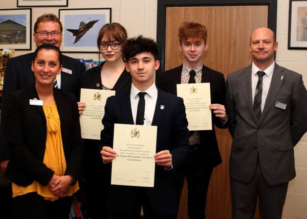 The presentation of the LRPS awards by Wayne Birks (Principal) (back left) to Daisy Hall, Luke Pattinson and James Kissack, with subject staff. Photo by Charly Walsh. EMN-170721-124249001
