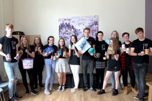 Louth teenagers celebrated a good haul of food items and cash to donate to the Community Food Larder, based at the Trinity Centre.