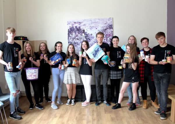 Louth teenagers celebrated a good haul of food items and cash to donate to the Community Food Larder, based at the Trinity Centre.