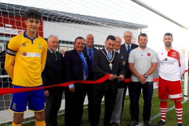 Mayor of Skegness Councillor Danny Brookes cuts the ribbon to officially open the Vertigo Stadium pictured with (from the left): Lincoln City youth captain Danny Horton; Derek Andrew, Lincs FA representative; Cllr Jim Carpenter, Skegness Town Council; Jim Eley, Boston League; John Mulhall, Lincs FA; Roger Gell, Boston League; Martin Jackson, Skegness Town Chairman; and club captain Miles Chamberlain. ANL-170724-113404001