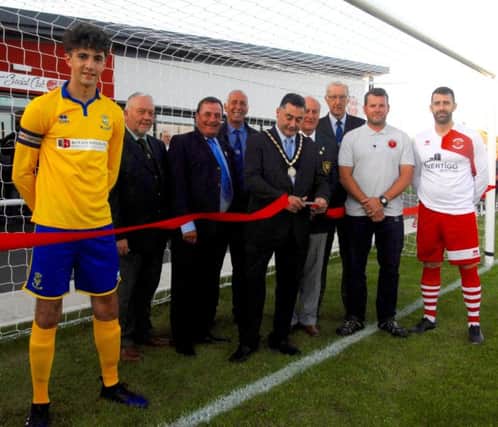 Mayor of Skegness Councillor Danny Brookes cuts the ribbon to officially open the Vertigo Stadium pictured with (from the left): Lincoln City youth captain Danny Horton; Derek Andrew, Lincs FA representative; Cllr Jim Carpenter, Skegness Town Council; Jim Eley, Boston League; John Mulhall, Lincs FA; Roger Gell, Boston League; Martin Jackson, Skegness Town Chairman; and club captain Miles Chamberlain. ANL-170724-113404001