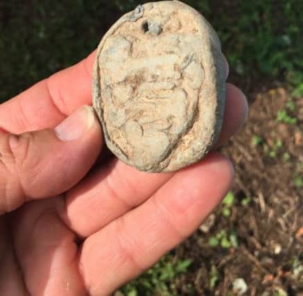 The carved seal featuring England's 3 lions