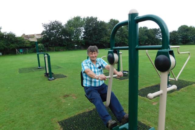 Heckington playing field steward Dave Couzens tries the leg press on the new outdoor gym equipment. EMN-170108-104217001