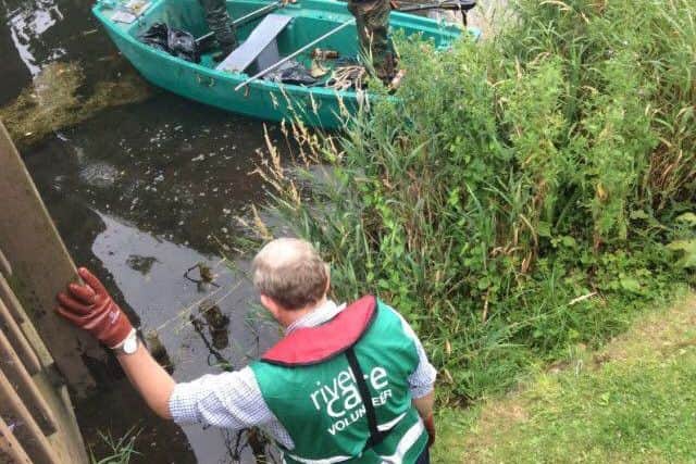 The Sleaford River Clean up team armed with their boat to get to those hard-to-reach items. EMN-170725-130007001