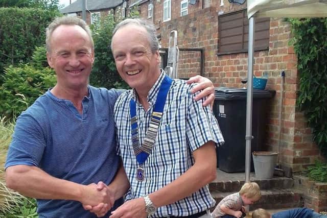Mike Armstrong handed over the chain of office to new president Peter Wilson.