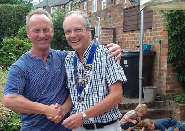 Mike Armstrong handed over the chain of office to new president Peter Wilson.