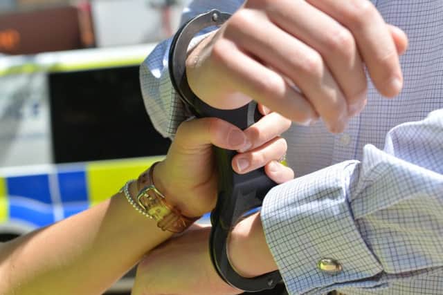 New figures released on use of force by Lincolnshire Police - handcuffs being put on. EMN-170726-142201001