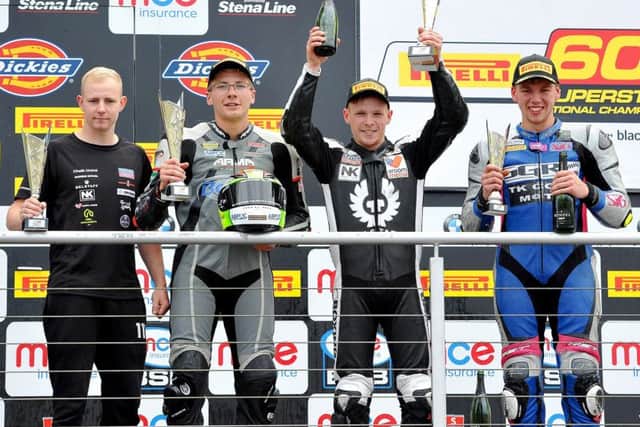 Tom Neave is flanked on the Brands Hatch podium by Brad Jones (left) and Tom Oliver EMN-170727-161715002
