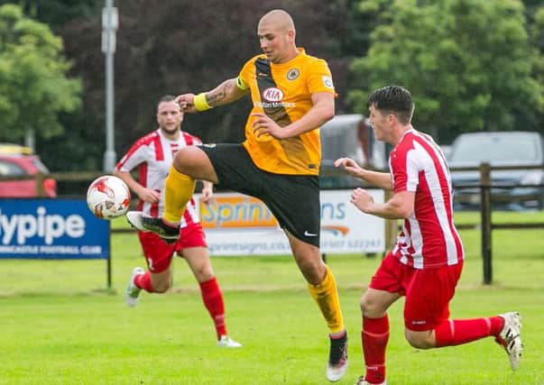 Gregg Smith battles for the ball at the Wong.