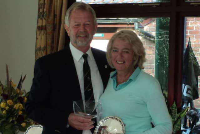 Club president Richard Holmes presents his prize and salver to ladies' winner Helen Gibbard EMN-170731-122023002