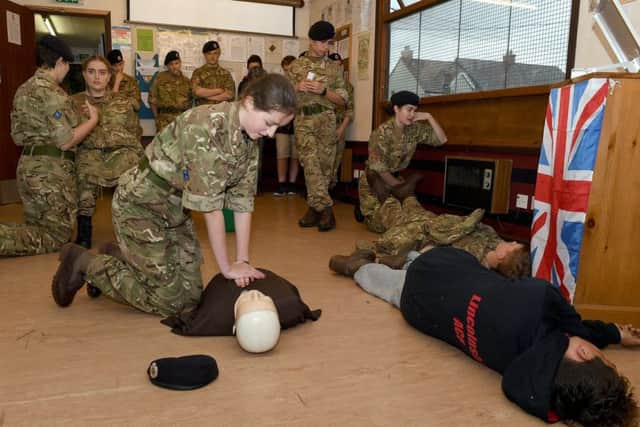 Billingborough cadets demonstrate their first aid skills to parents, with a mock incident involving a cyclinst and a car. Cadet Chloe Slipper doing CPR. EMN-170731-180307001