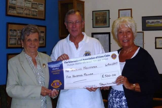 Barbara Roberts (right) receives the ?500 donation to Sleaford Talking Newspaper from Sheila Waller and Lion John Kyte. EMN-170308-154439001