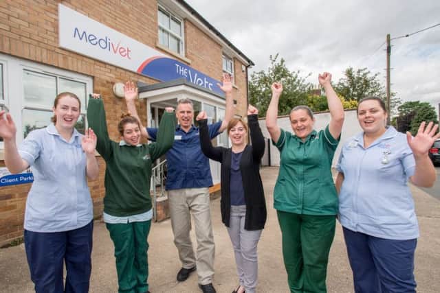 Ready for a party: Vet Dave Kenyon with staff at the Merivale Practice.