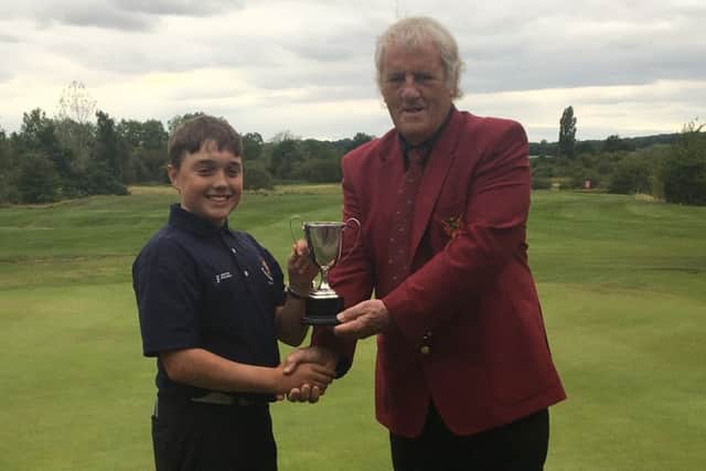 Michael Baines receives his trophy from club captain Terry Marshall EMN-170808-101211002