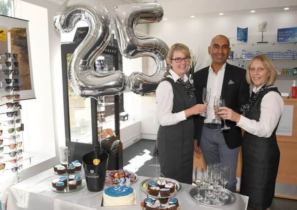 Lunettes Opticians, Sleaford, celebrating 25th anniversary. L-R Louise McCarrick, Tushar Majithia - owner, Janet Ratcliffe. EMN-170208-105120001