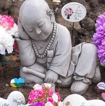 The Buddha statue stolen from a grave in Sleaford Cemetery