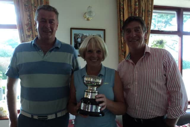 Steve Hewish (left) and Tilly Lawrence receive the Banovallum Bowl from men's captain Gaff Elliott EMN-170308-120430002