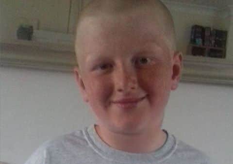 Taylor Palmer with his bald new look. EMN-170814-161529001