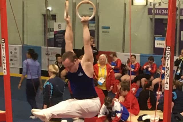 Gymnast Andrew McLaughlin powering his way to a  bronze medal on the rings at the Summer Games in Sheffield EMN-170814-225337001