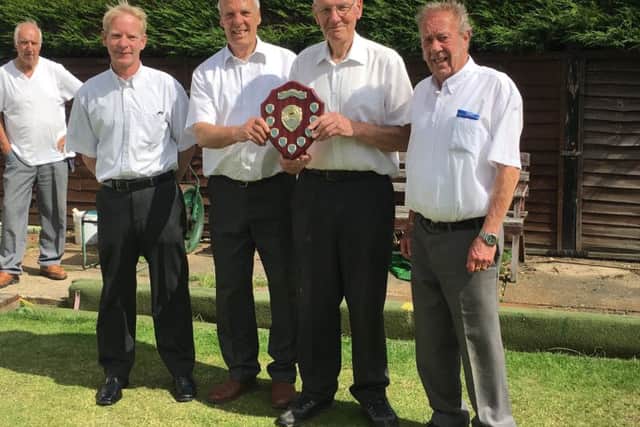 From left, Jim Geary, tournament winners Allan Chandler and Vic Everett, and tournament sponsor Martin Harvey. EMN-170908-172410002
