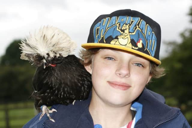 Sanctuary volunteer Chelsie Healey with 'Beryl' - one of the resident chickens.