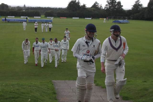 Rain forces Caistor batsmen Gareth Johnson and Nathan Davies to leave the field as they chase down Market rasen's total EMN-170814-144124002