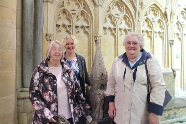 Some of the members of the Sleaford knitting group with Marion Sander of ArtsNK at the cathedral with their creation. EMN-170815-122011001