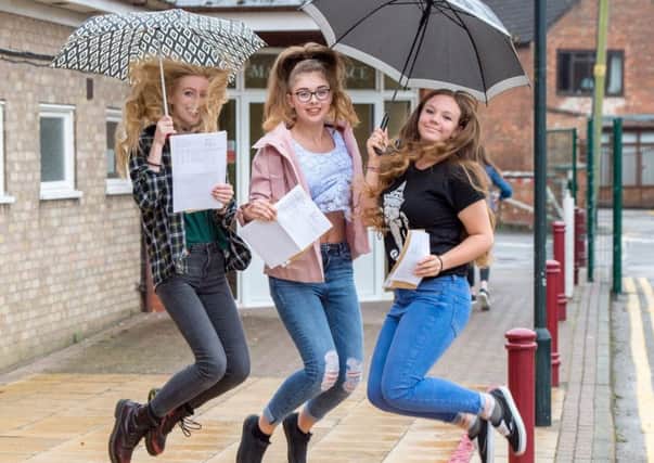 Vicki Simons, Emily Osborne and Kelly Pawson are literally jumping for joy with their results.