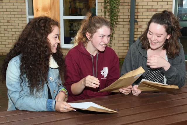 A-Level Results. Kesteven & Sleaford High School. L-R Georgia Markham 18, Olivia Sealy 18, Caitlin O'Rourke 18. EMN-170817-105751001