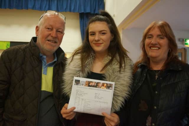 Bobbie Brader celebrated her results with dad Graham and mum Julie. She is heading to Bishop Grosseteste University in Lincoln to study Drama. EMN-170817-111821001