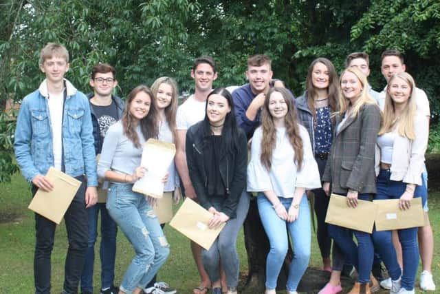 Students at Queen Elizabeths Grammar School celebrating their A-Level results. ANL-170817-133423001