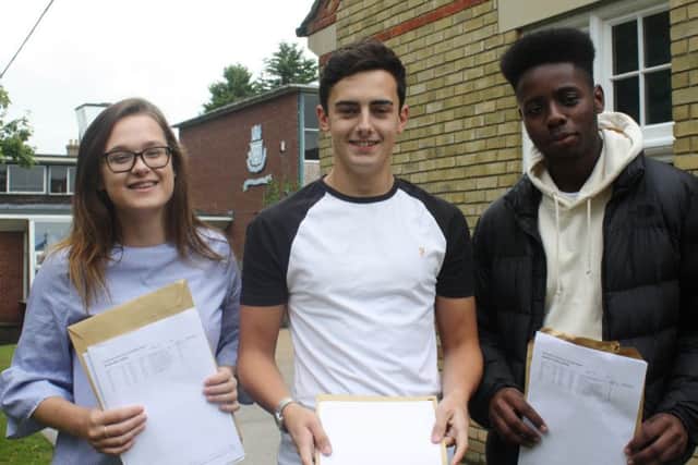 Students at Queen Elizabeths Grammar School celebrating their A-Level results.  Pictured left to right are Elle Smith, Ollie Burbidge and Joshua Appiah.