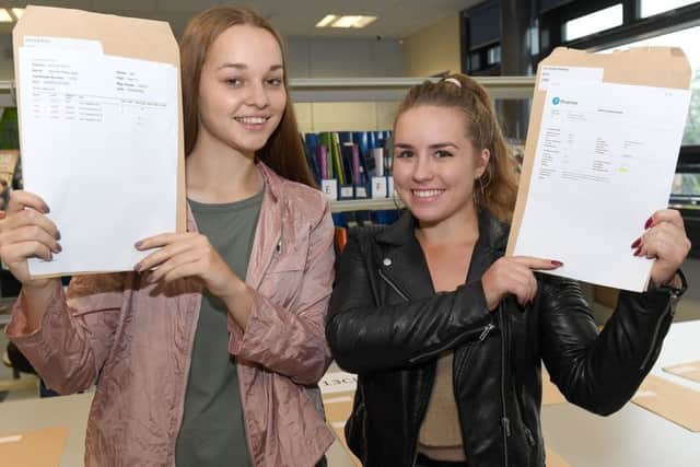 A-Level Results. St George's Academy. L-R Hannah Keal 17, Eve Scott-Golding 18. EMN-170817-105712001