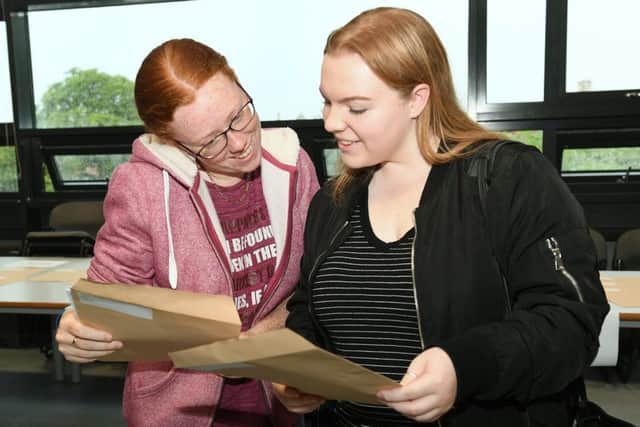 A-Level Results. St George's Academy. L-R Megan Devine 18 and Caitlin Pointon 18. EMN-170817-105630001
