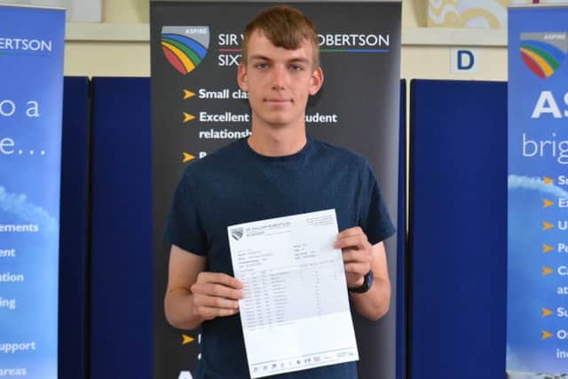 Adam Saxby from Carlton le Moorland with his A level results. EMN-170817-164146001