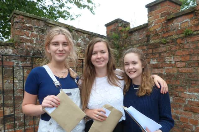 Ella Hodson (1Bs, 2Cs (left), Niamh Rafftery (1A,1B,1C) and Emma Harper-Smith (2B,1C). Ella is going to Paris to work as an au pair, Niamh is going to Newcastle University to study Geography and Emma is going to study Sports Management at Leeds Beckett University. (Lin) EMN-170817-200337001