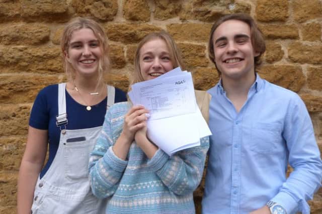 A delighted Mel Nash (3A*s 1A) pictured with Luke Green and Ella Hodson. (Lin) EMN-170817-200351001